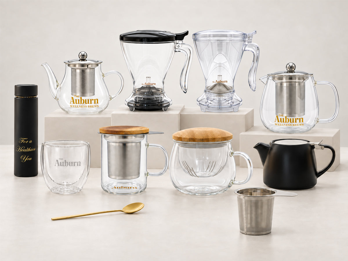 The Auburn Brew Maker Jug, glass mug, strainer, teapot and gold spoon