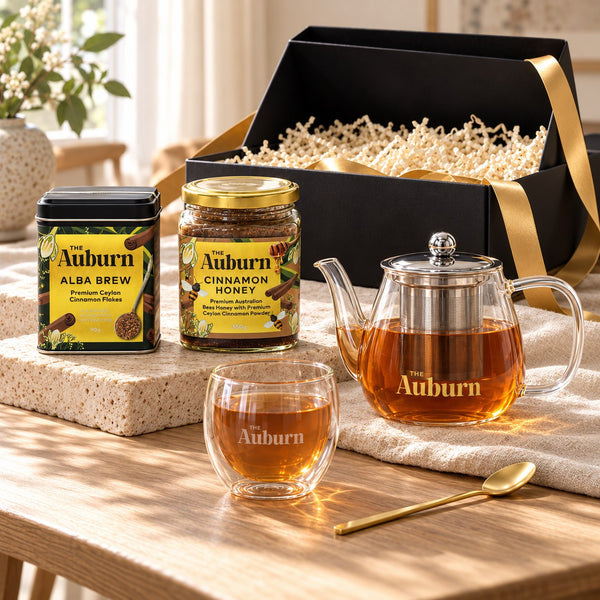 Thank You SO MUCH hamper: an Alba Brew tin, a jar of cinnamon honey, a glass teapot, a glass mug and a gold tea spoon.