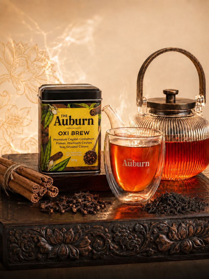 Oxi Brew tin with a glass teapot and a steaming cup